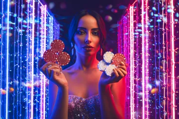 JILI696 App — Fast, responsive, and optimized for all devices A cheerful woman in traditional clothing using her smartphone during a festive moment, showing how easily the JILI696 app fits into everyday life.