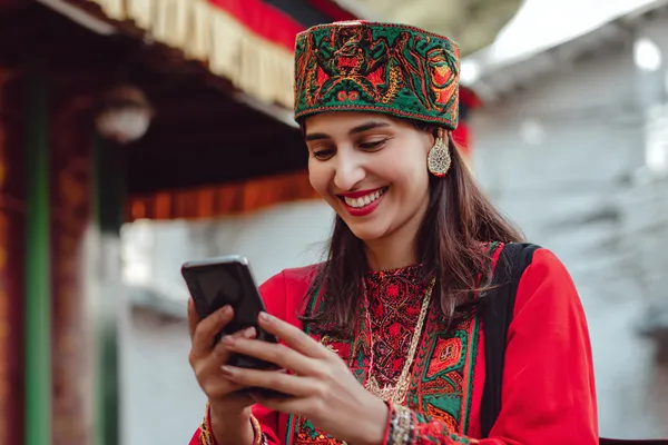 JILI696 Member Login — Return to your personalized dashboard A person using their device against a moody casino-themed background, illustrating the smooth re-entry process at JILI696.